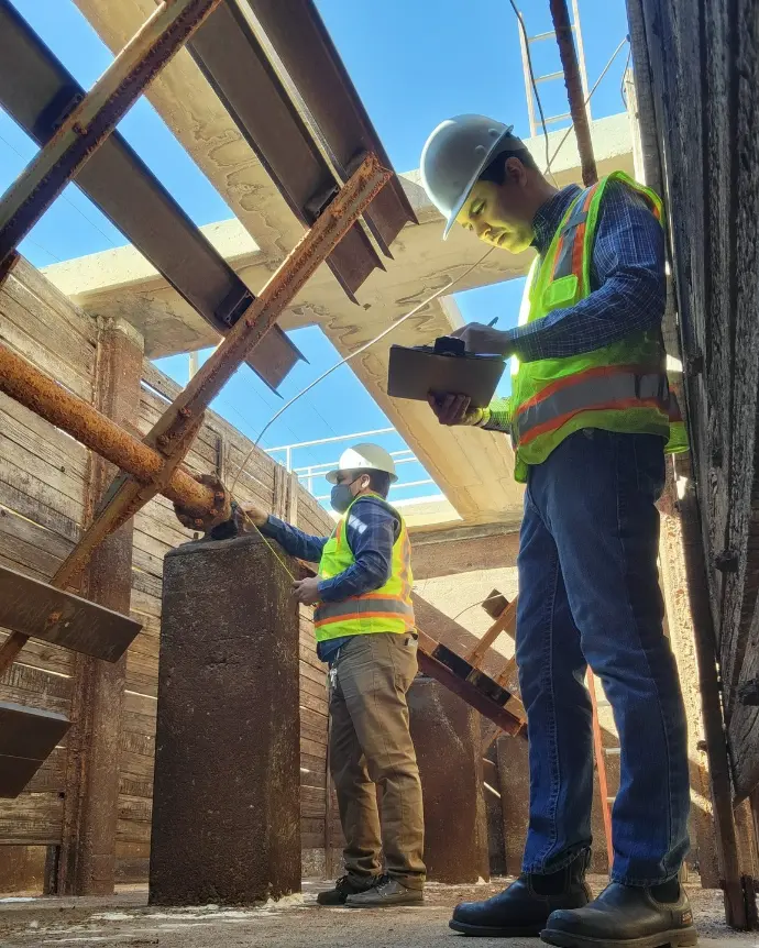 RBC Industrial engineers taking precise measurements of old flocculator parts for reverse engineering and redesign
